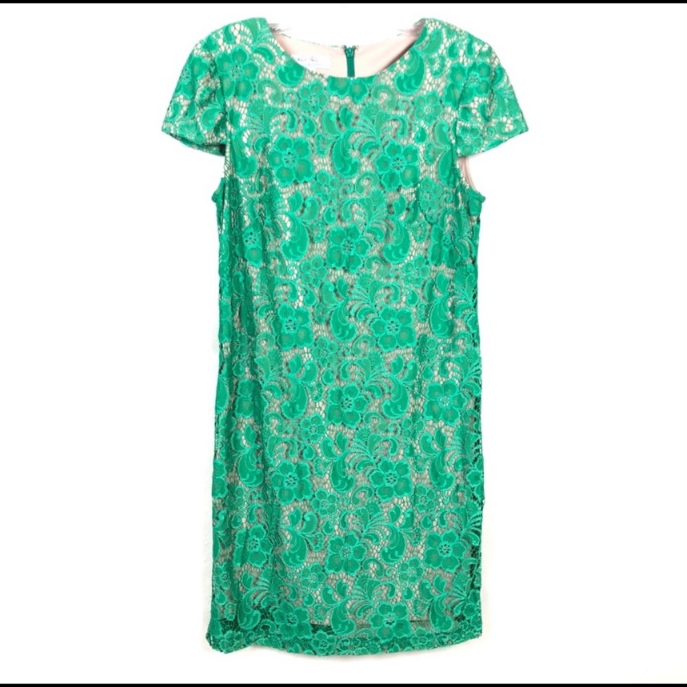Jade colored lace dress. Completely lined in nude color fabric. Short sleeve.